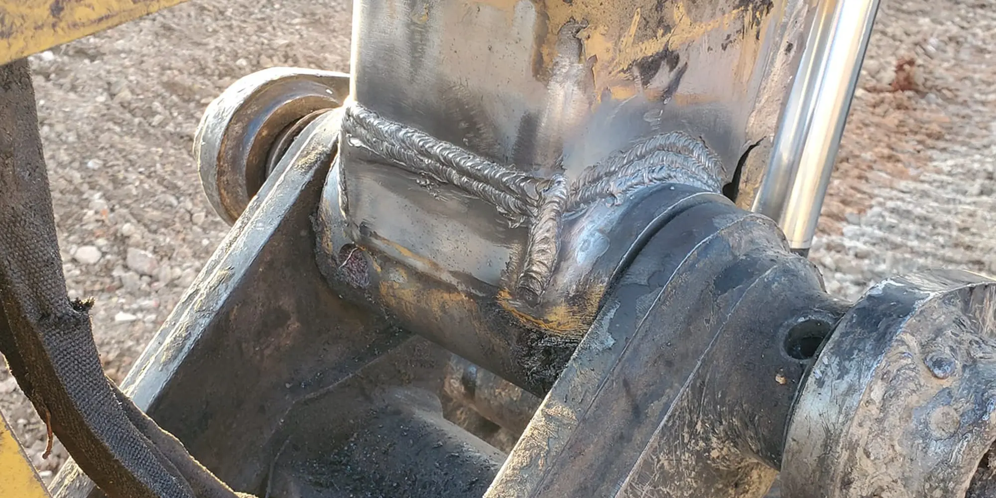 This image shows a strong weld on a backhoe bucket assembly.